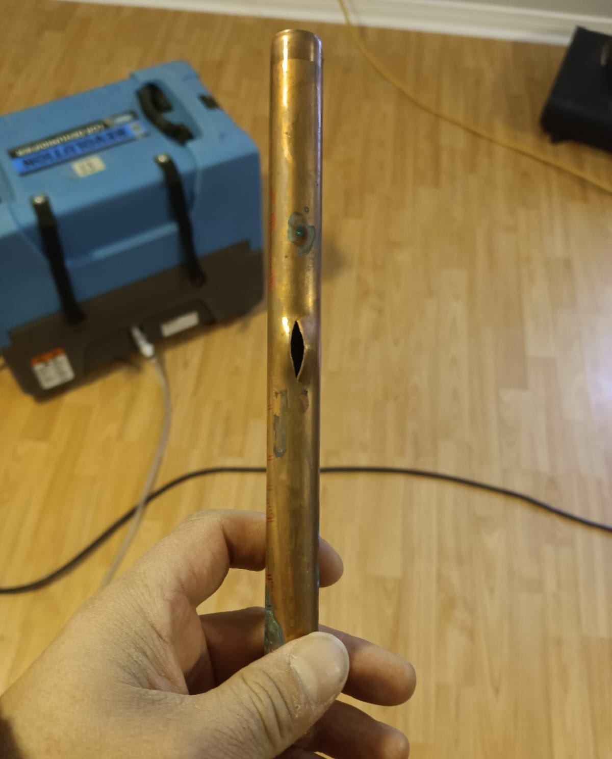 Burst copper pipe — the source of the leak